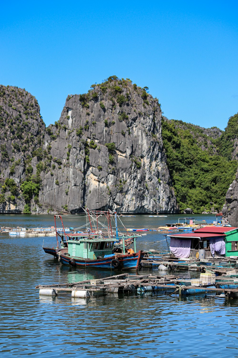 a number of small boats in a body of water