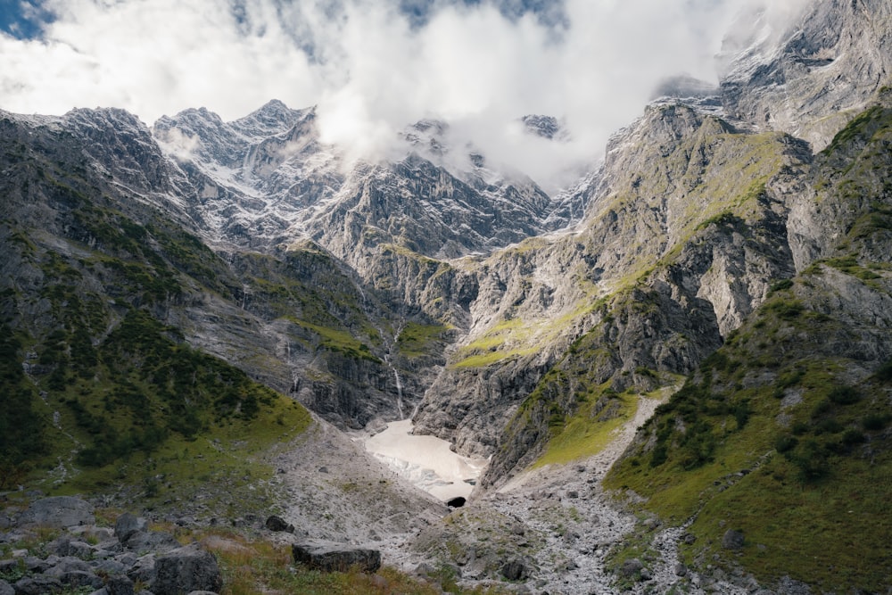 a view of a mountain with a lake in the middle of it