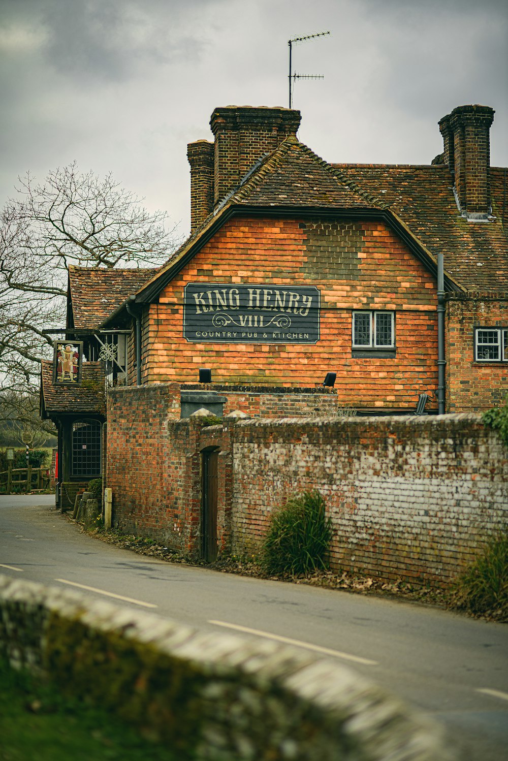 a brick building with a sign on the front of it