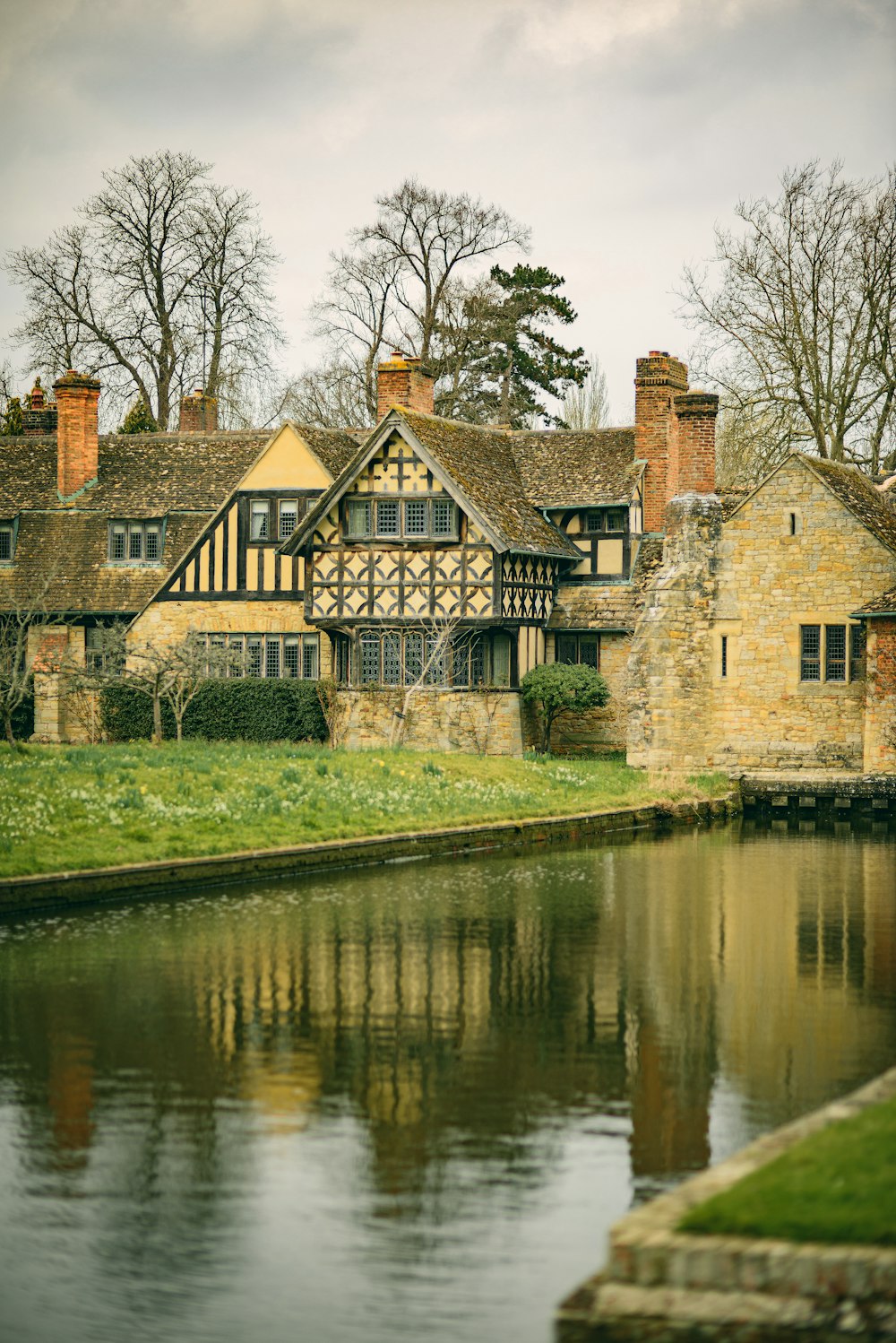 a house with a pond in front of it