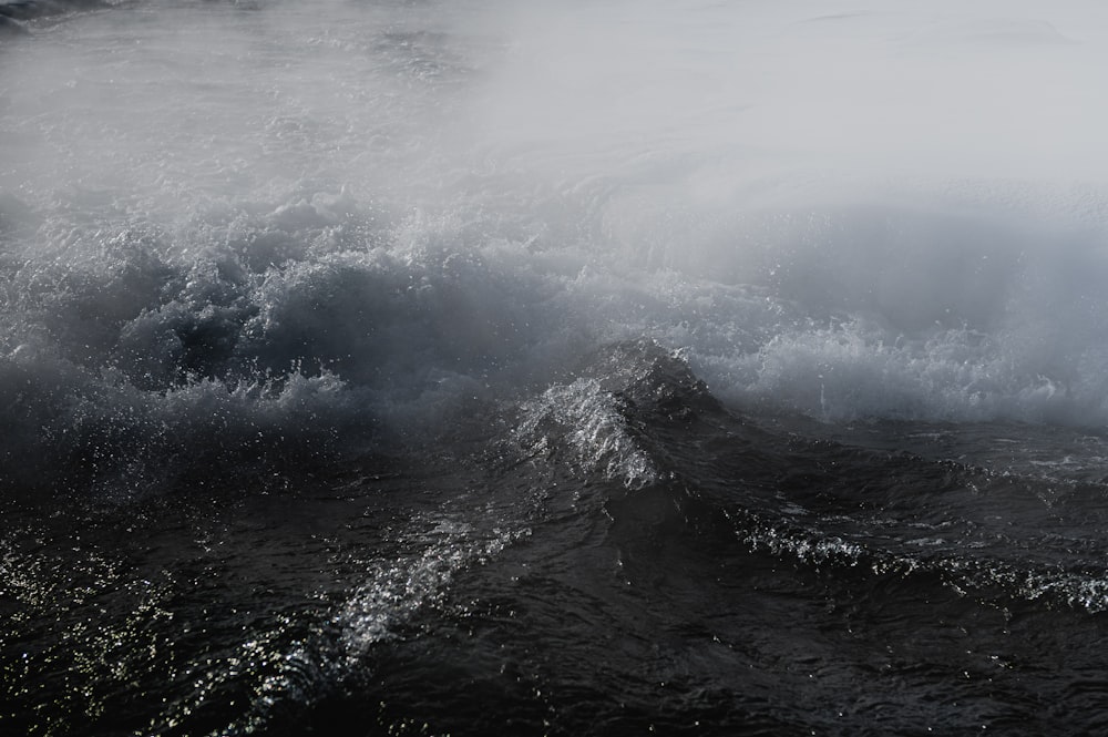 a large body of water surrounded by waves