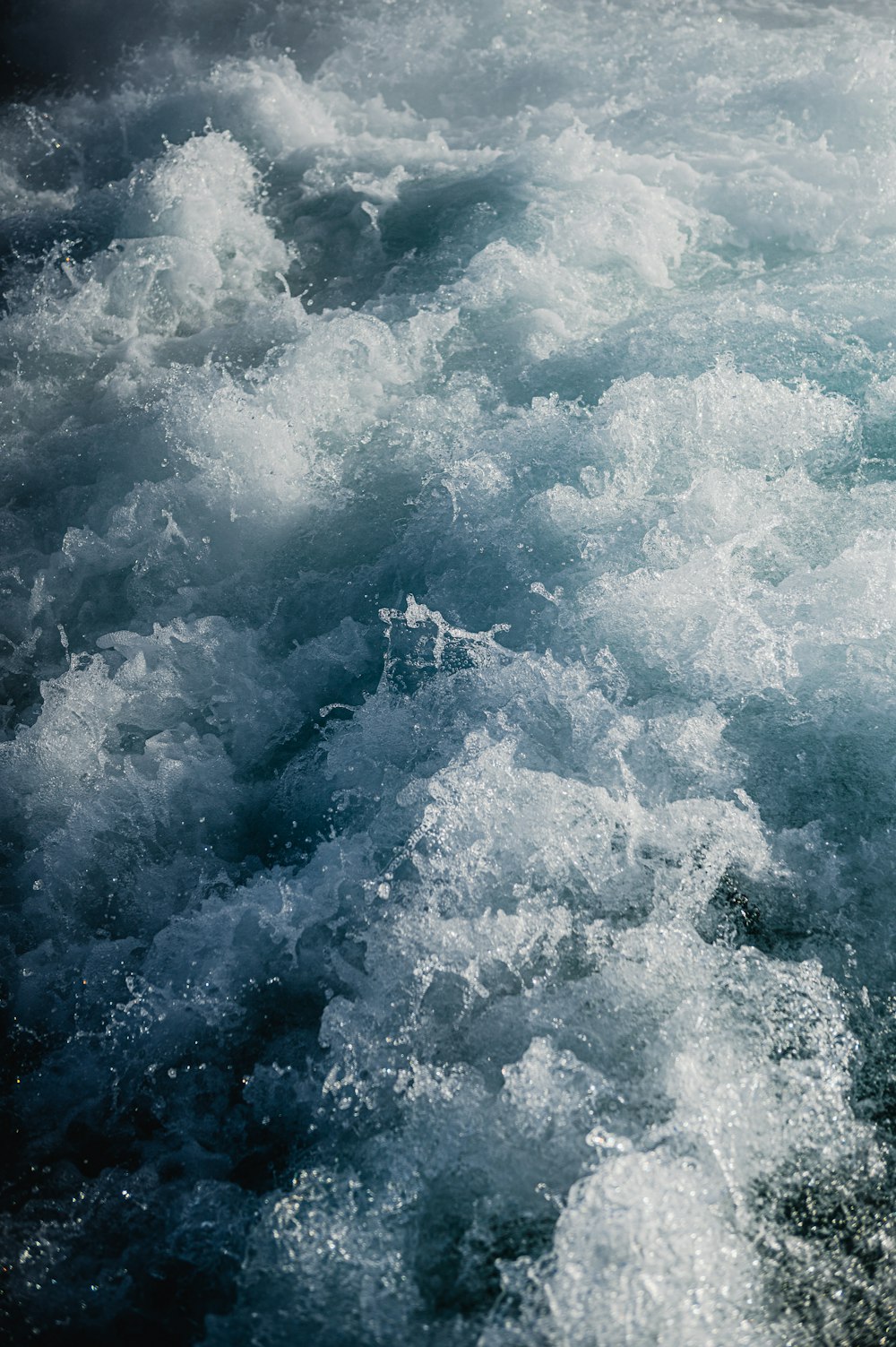 a person riding a surfboard on top of a body of water