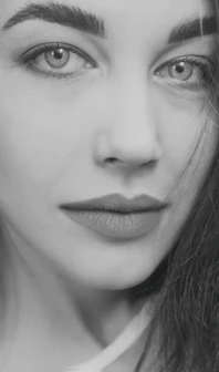 An intimate close-up portrait highlighting fine details and natural textures in soft, warm tones.