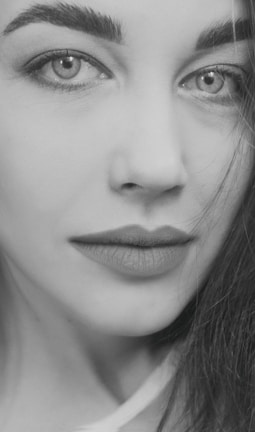 Portrait with soft warm tones, natural skin retouching, and sharp eyes.