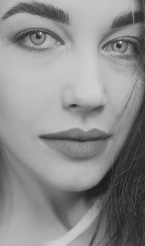 A detailed portrait of a woman with expressive eyes and soft lighting.