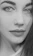 Close-up of a detailed graphite portrait showing delicate shading and texture.