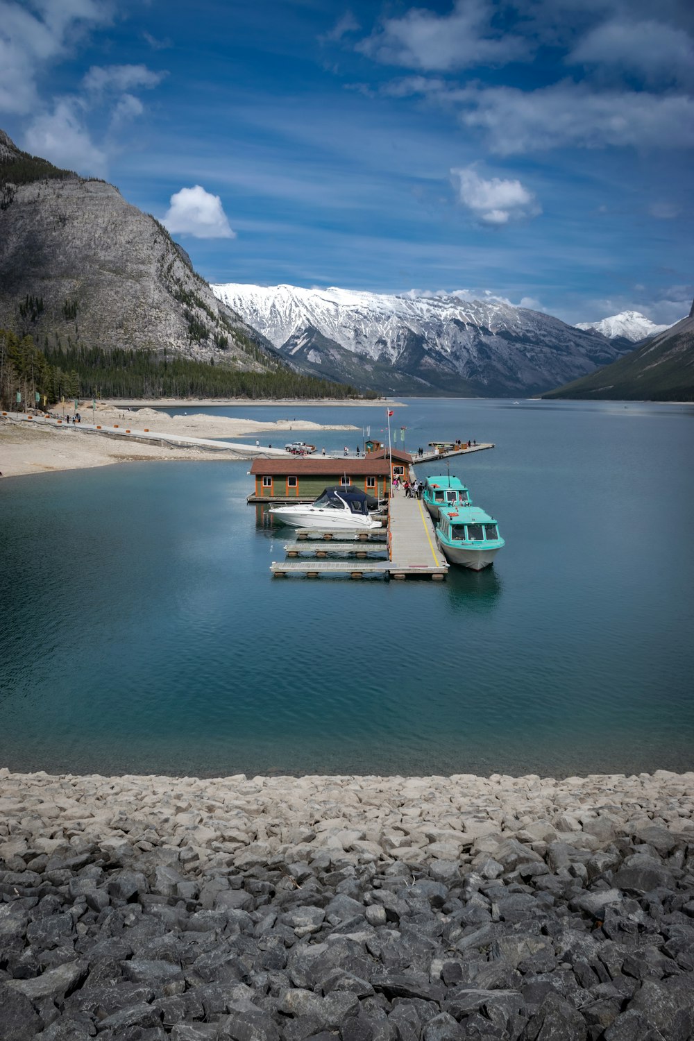 a body of water surrounded by mountains and rocks