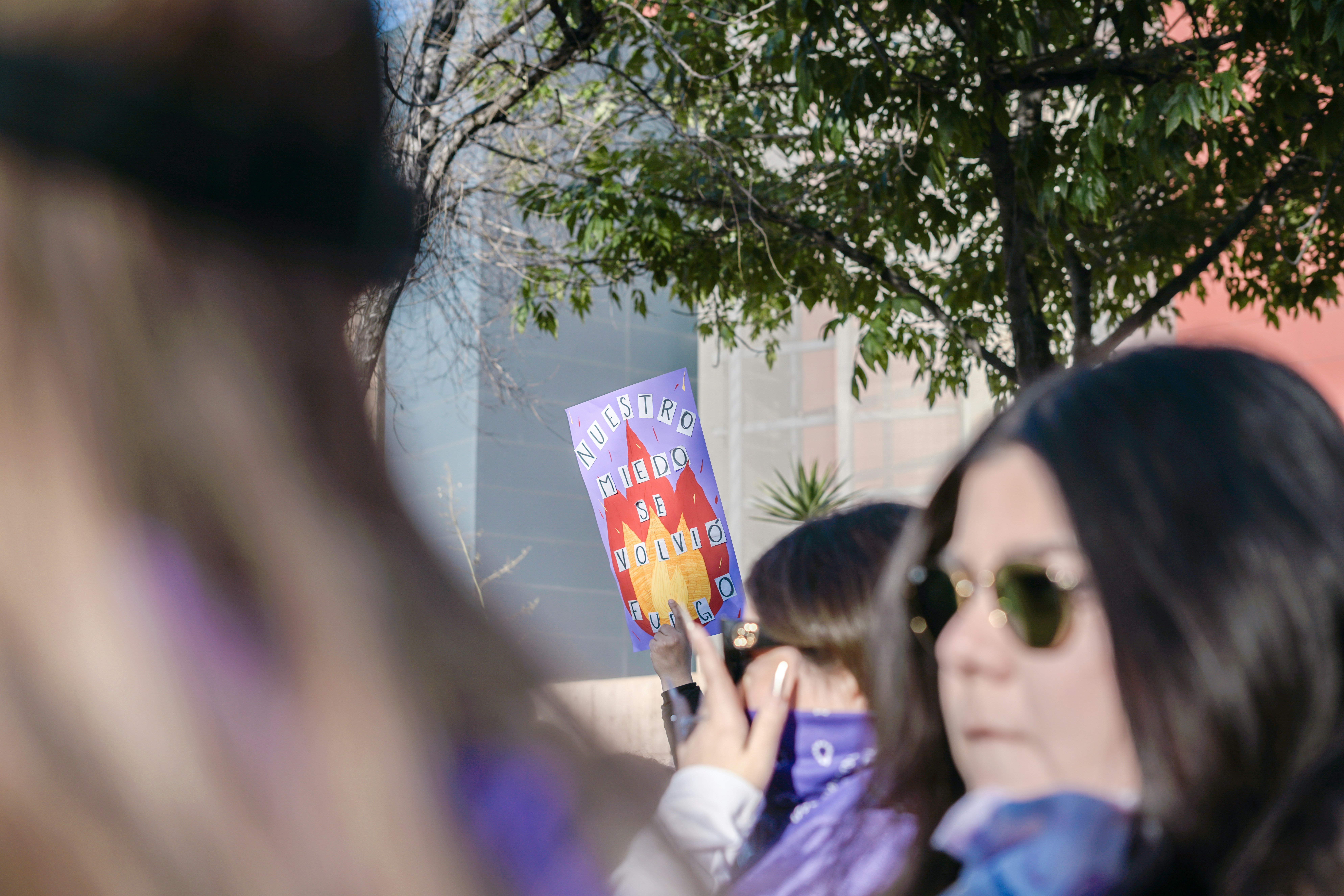 a group of people standing around each other