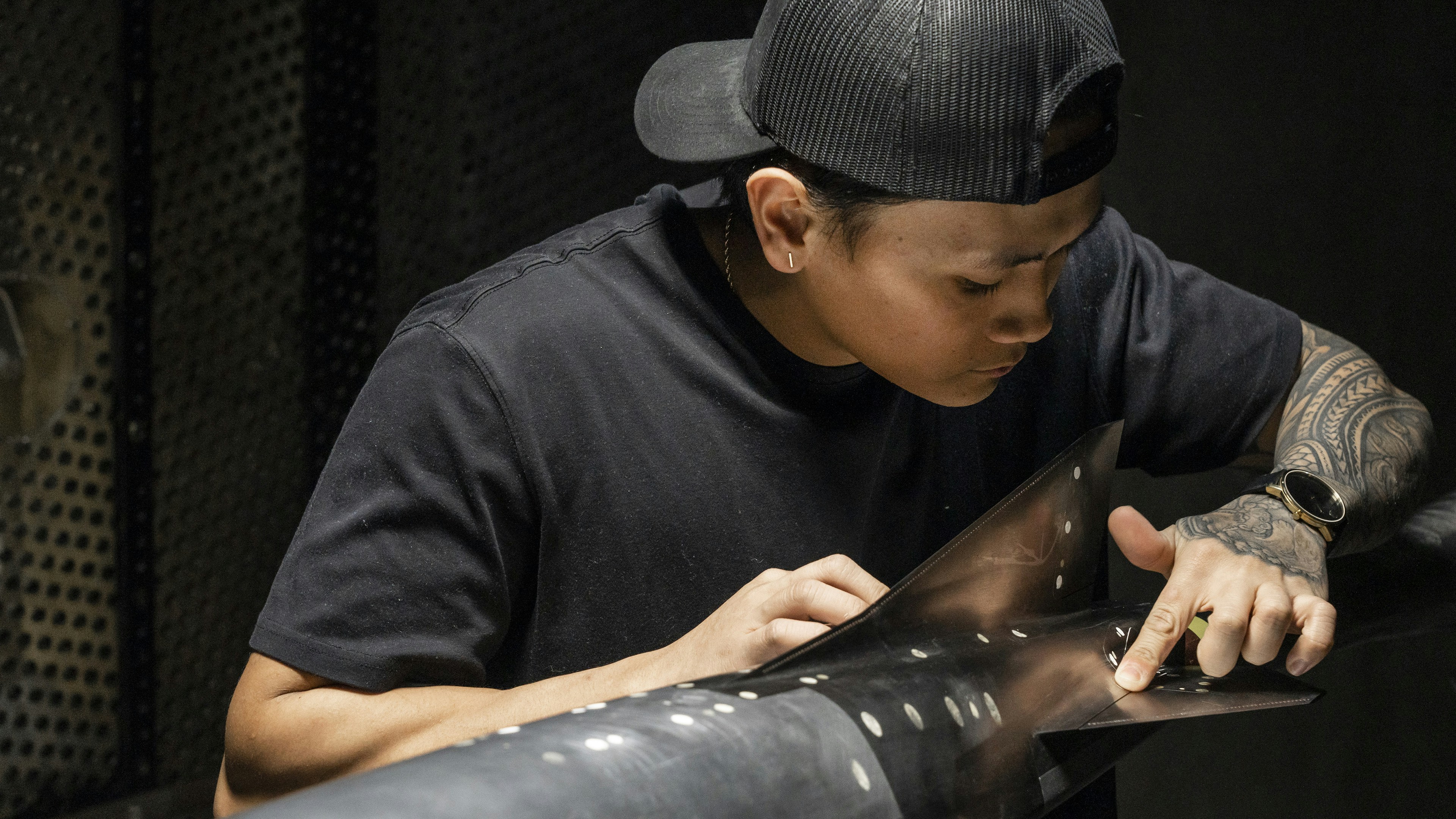 professional technician adjusting torsion spring - roll up door fix