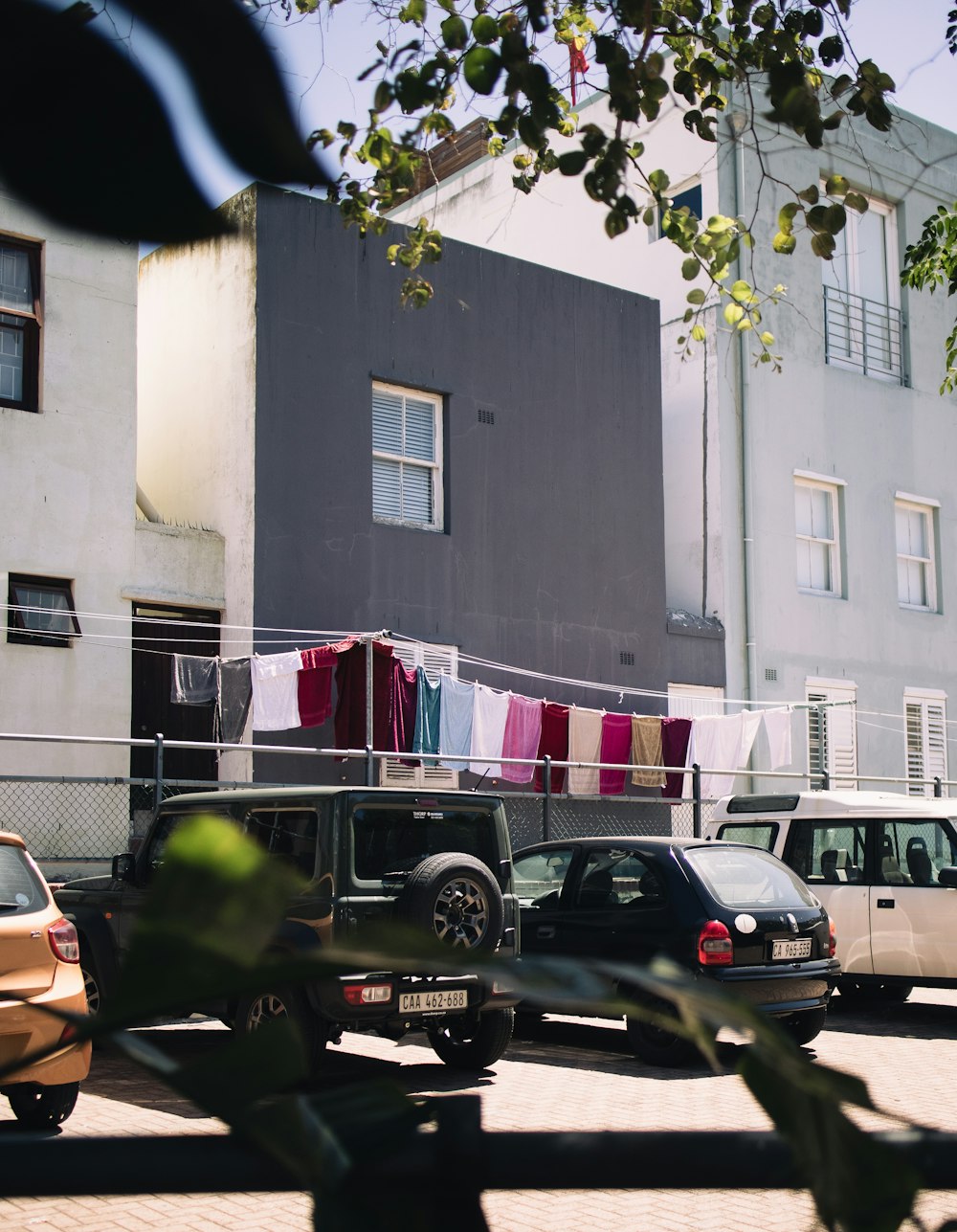 a row of parked cars in front of a building