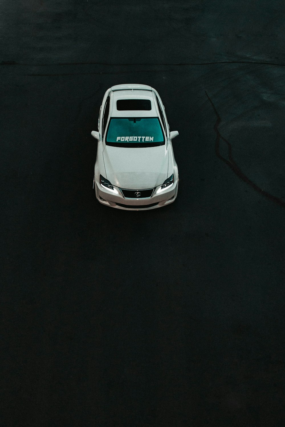 a white car parked in a parking lot