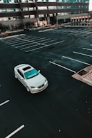 a white car parked in a parking lot