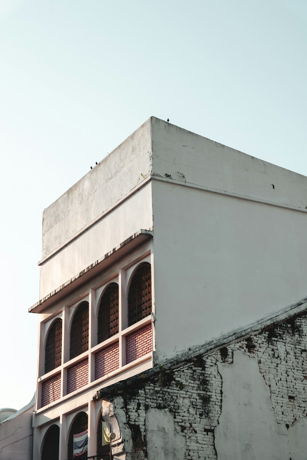 a tall building with a clock on the side of it