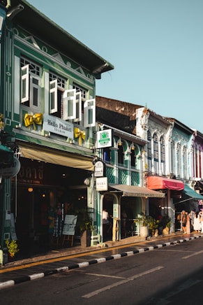 a row of buildings on the side of a street