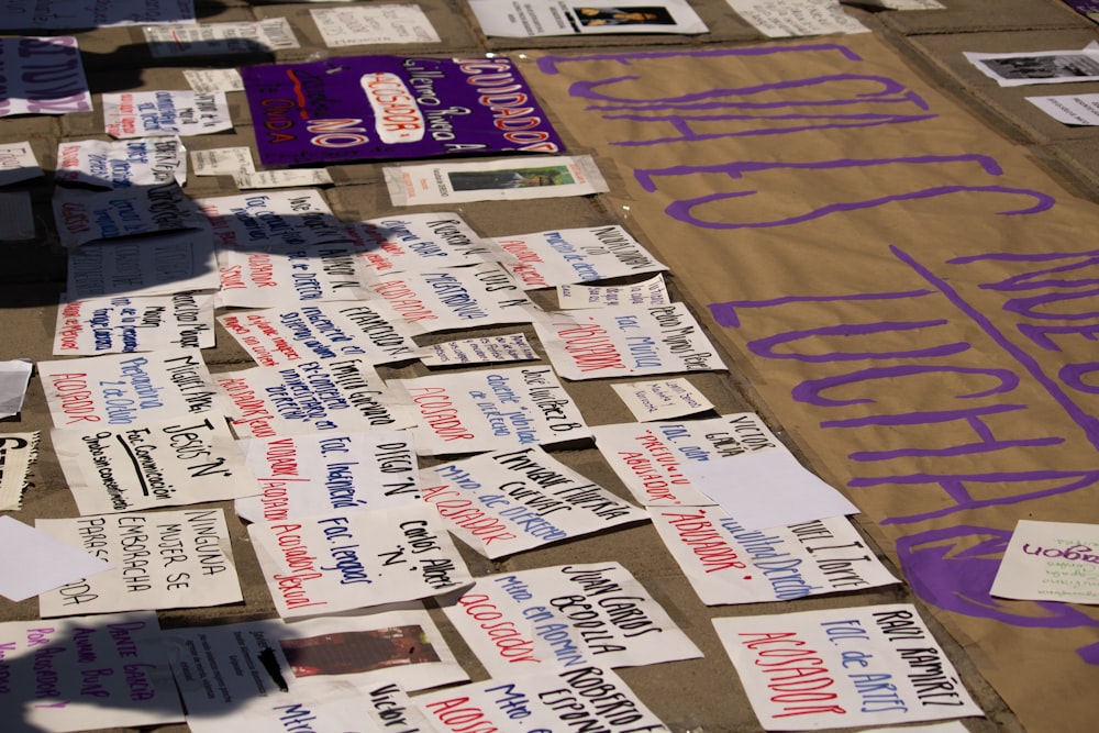 a table covered with lots of papers and stickers