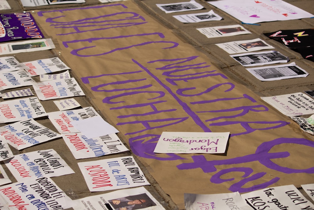 a bulletin board with purple writing on it