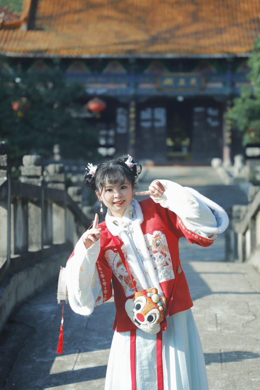 a woman in a traditional chinese costume poses for a picture