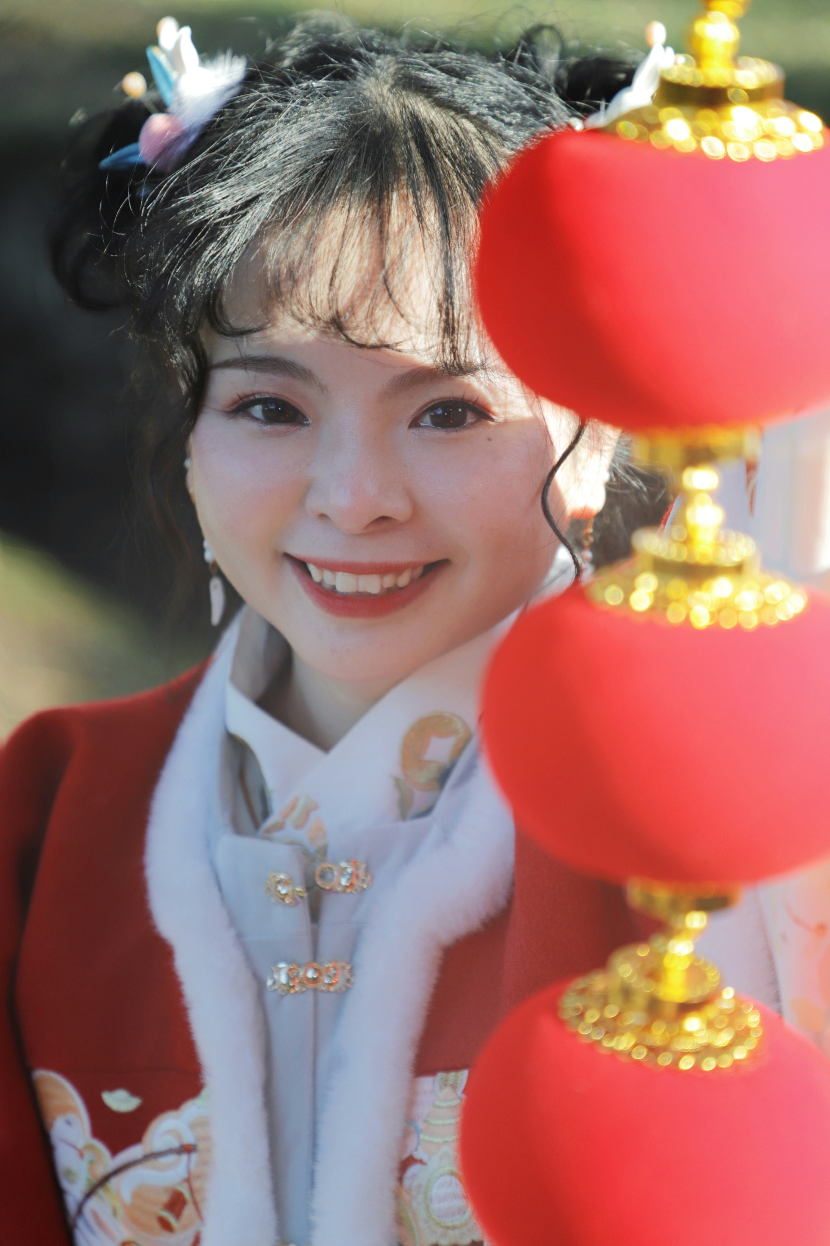 a woman wearing a red and white outfit and smiling