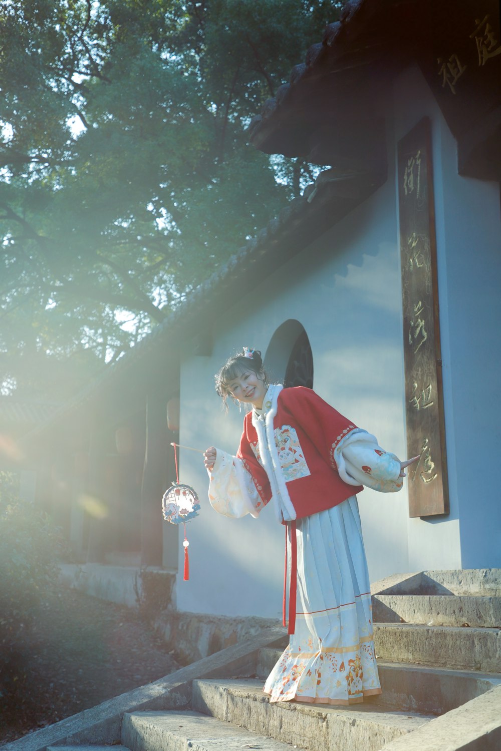 a woman in a red and white outfit standing on steps