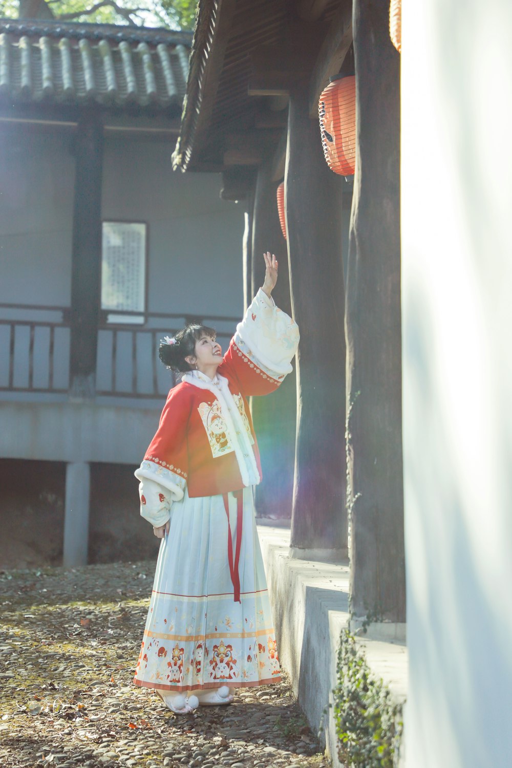 a woman dressed in a costume standing next to a building