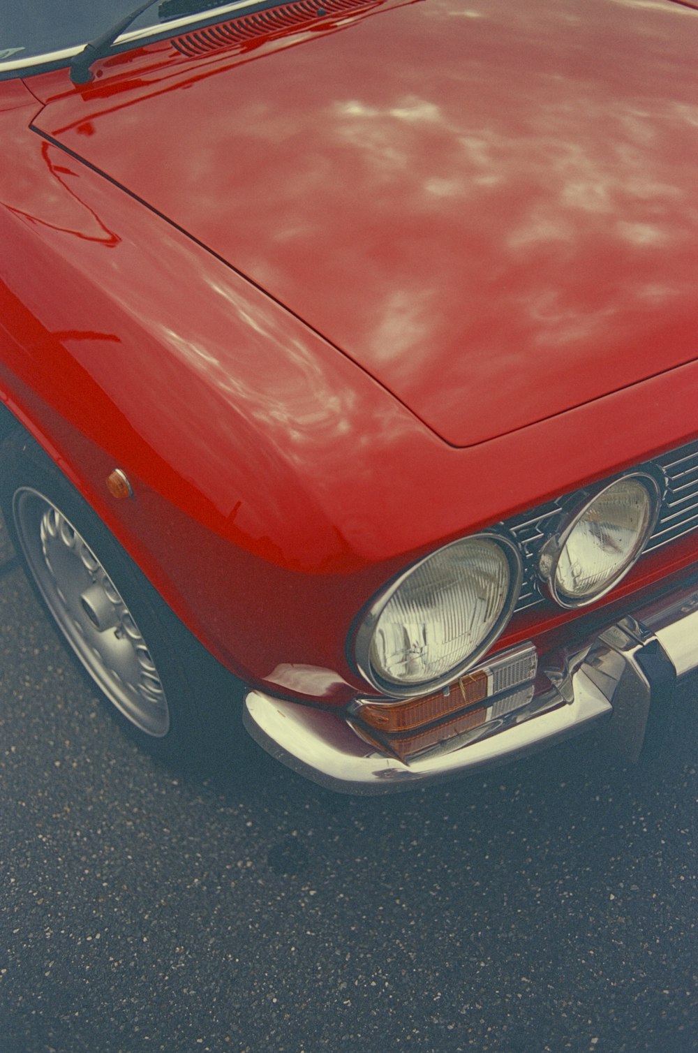 a red car parked in a parking lot