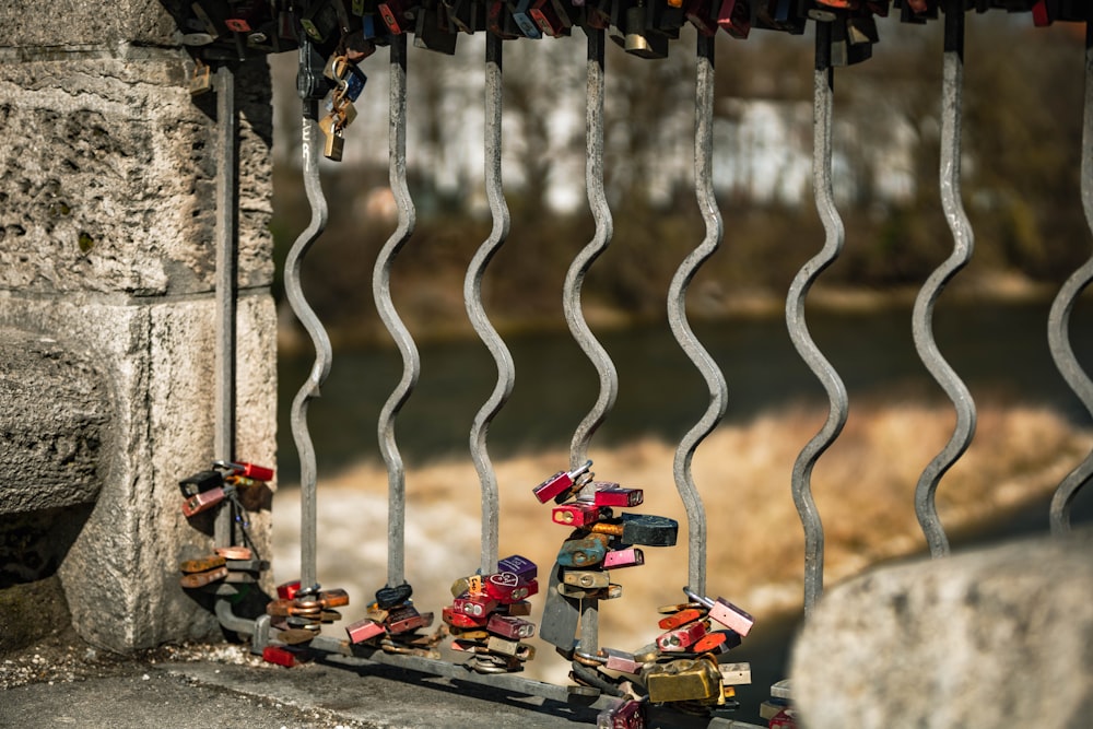 a bunch of locks are attached to a fence