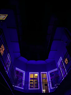 Modern real estate office interior with sleek purple and black accents reflecting luxury.