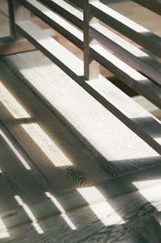 white oak hardwood wooden bench on wooden floor