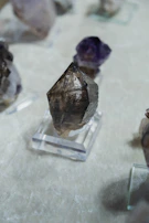 A collection of radiant crystals glowing softly against a black velvet background.