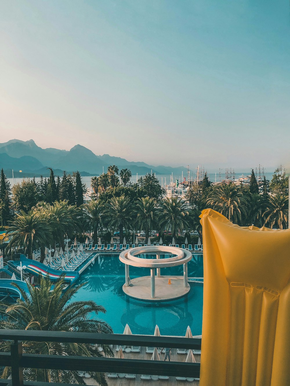 a view of a swimming pool from a balcony