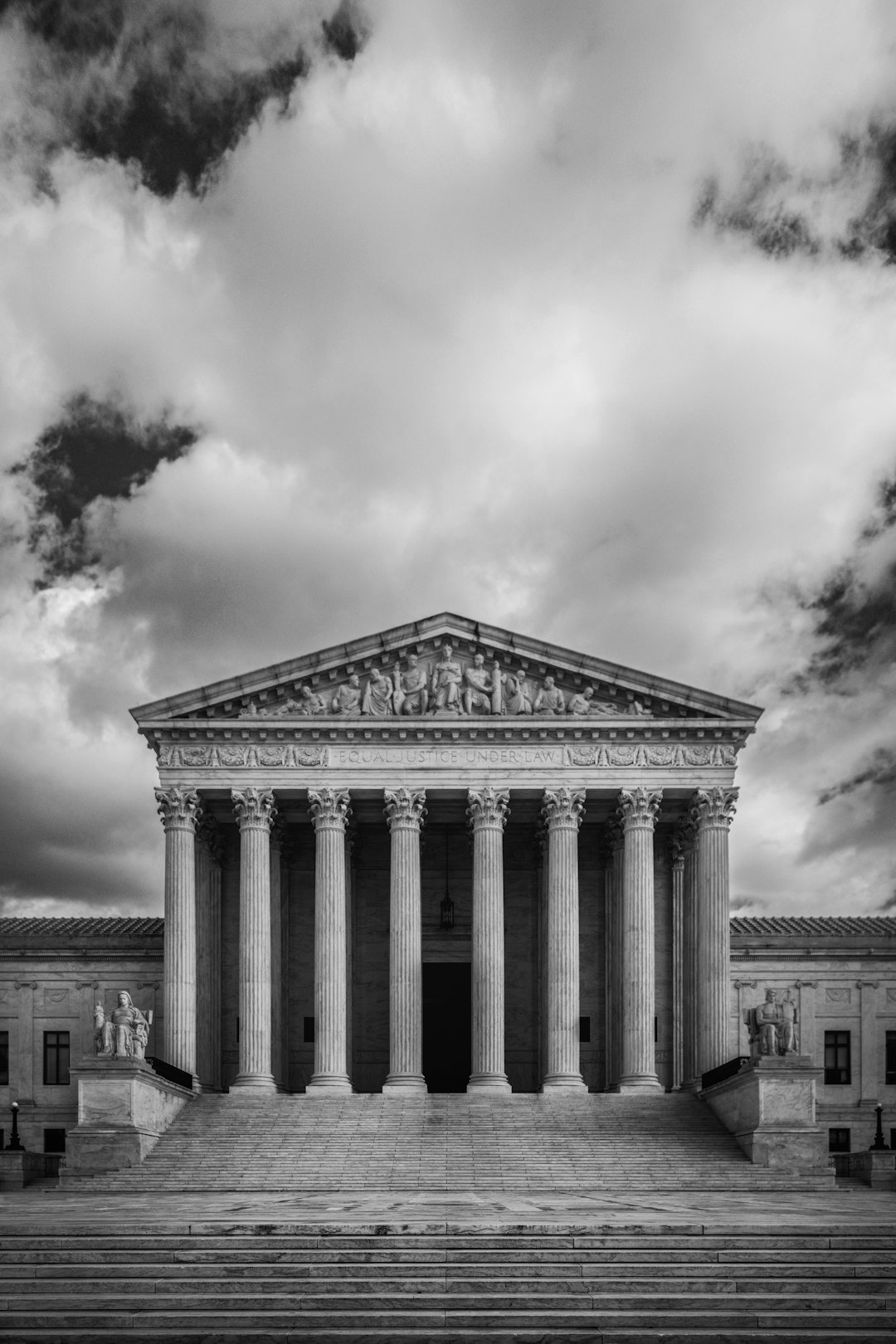 a black and white photo of the supreme court