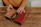 Happy man opening a pizza box with a bright, appetizing pizza inside