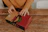 Happy man opening a pizza box with a bright, appetizing pizza inside