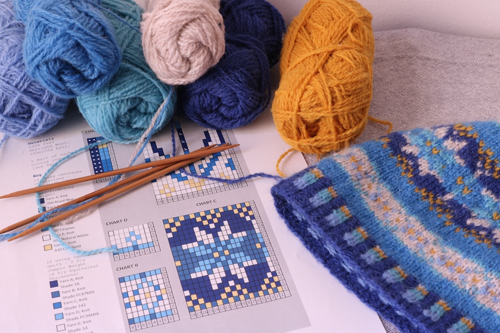 a group of balls of yarn sitting on top of a table