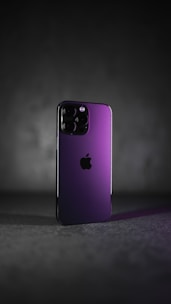 A sleek smartphone with a purple and black background reflecting the Celucast brand colors.