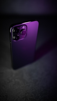 A sleek smartphone displaying a striking high-end portrait enhanced by cinematic lighting, showcasing the power of gemini ai photo prompts.
