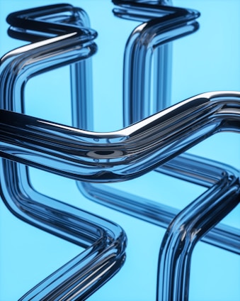 a close up of a metal object on a blue background