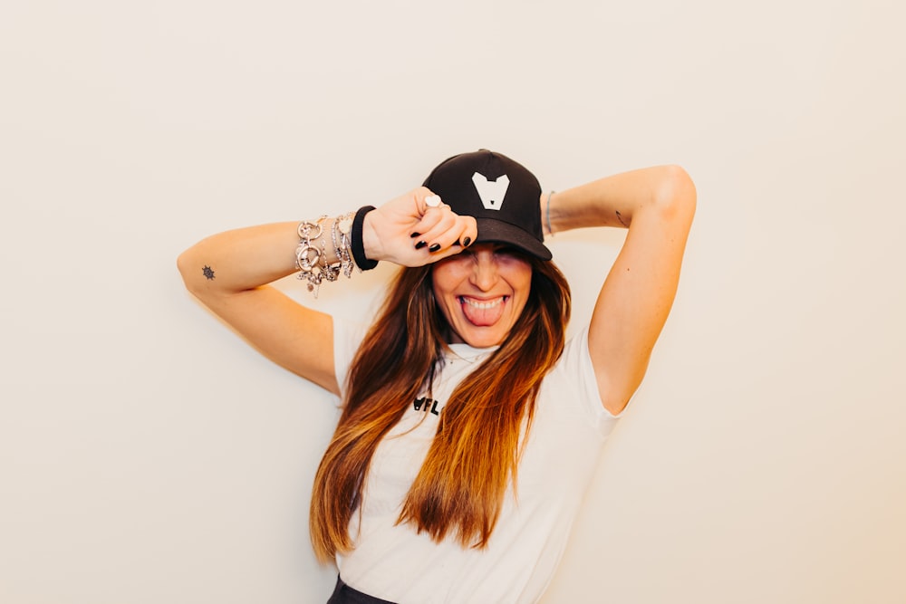 a woman with long hair wearing a hat