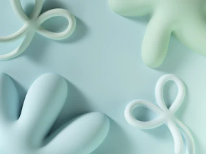 Soft ocean-toned abstract 3D shapes gently overlapping with subtle geometric patterns.