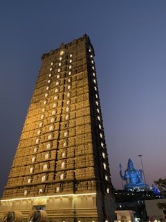Golden statue of Shri Tirupati Balaji under soft temple lighting
