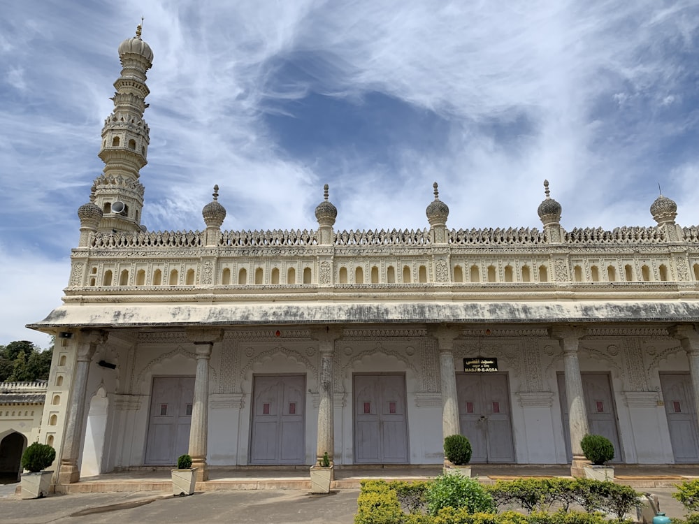 a white building with a tall tower on top of it