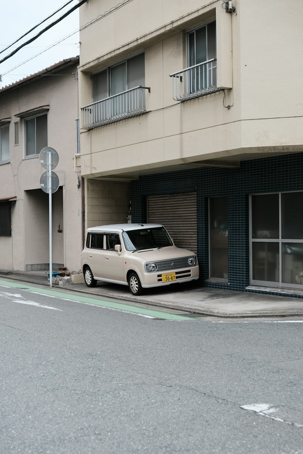 a small van parked in front of a building