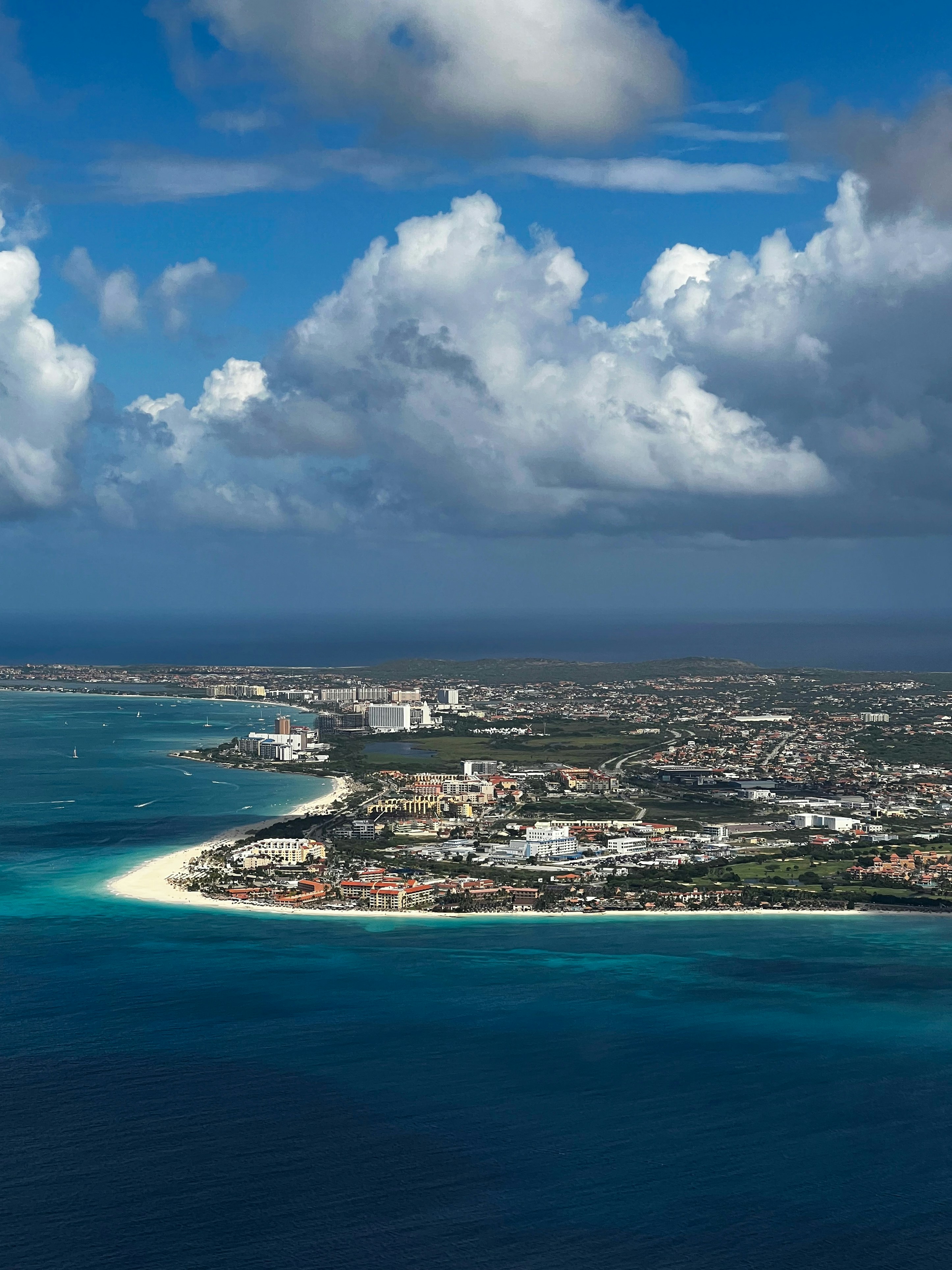 an aerial view of a city and the ocean