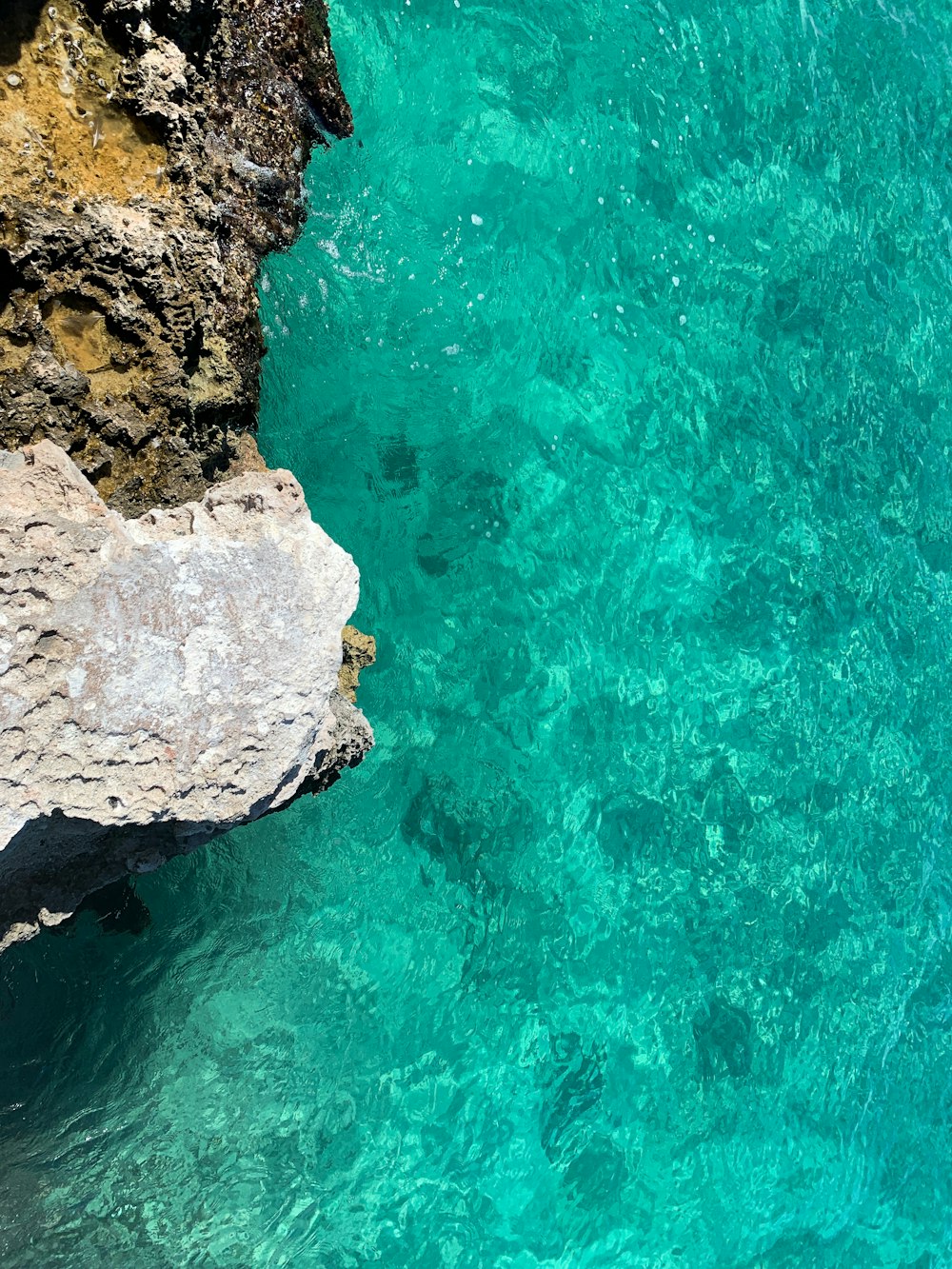 a view of the water from a cliff