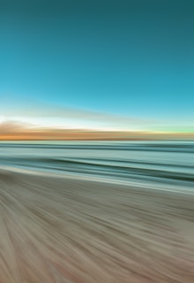 A serene ocean scene blending blue and green hues with soft cream accents.