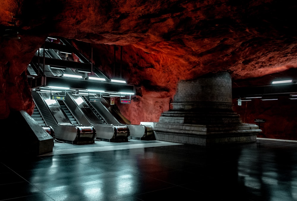a group of escalators sitting in a cave