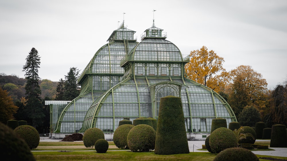 a large green building with a lot of trees around it