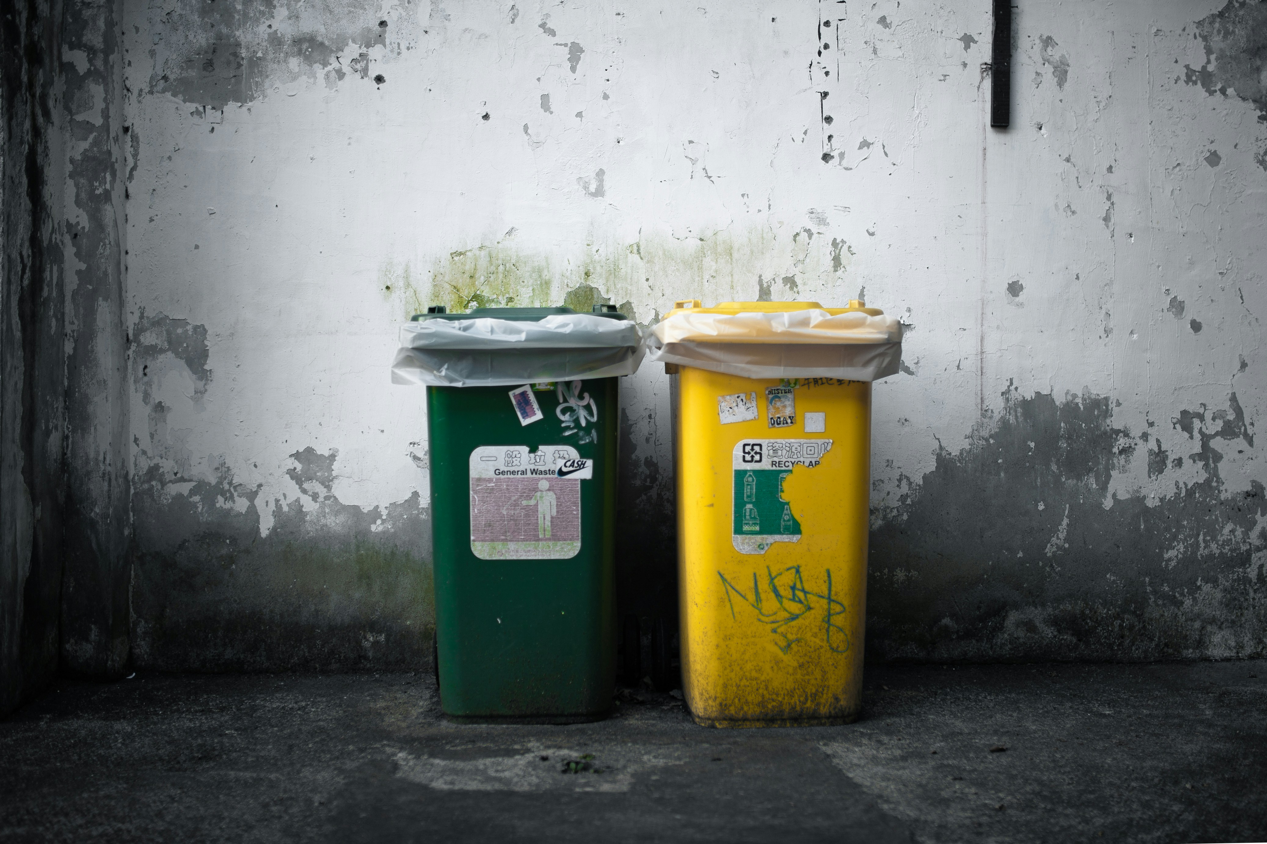 Trash cans on the side of the road