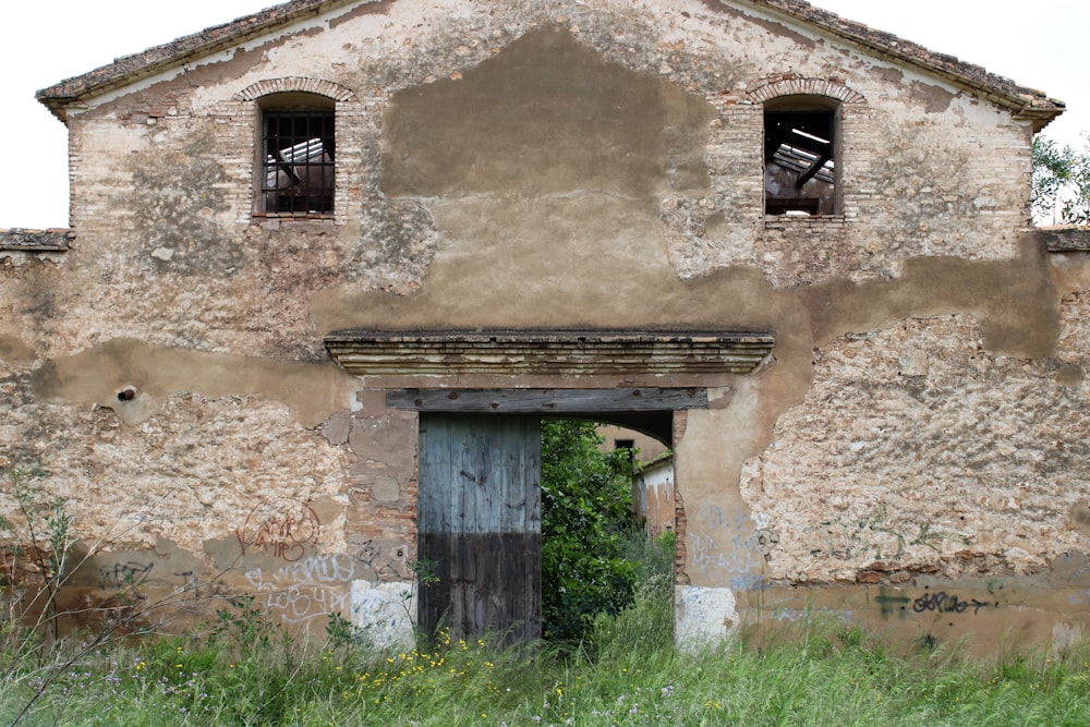 an old building with a wooden door and window