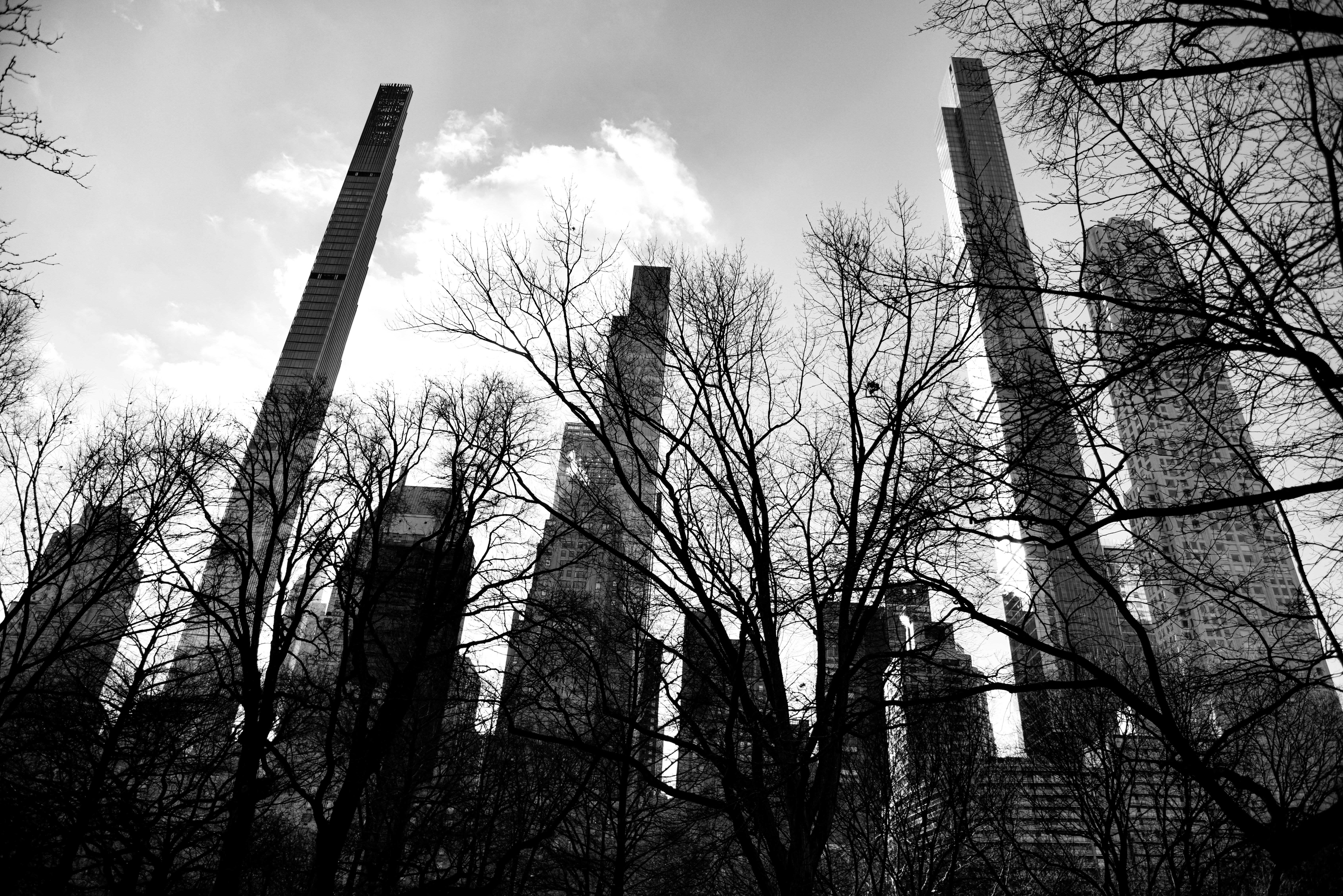 a black and white photo of tall buildings